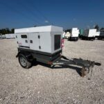 Skid-mounted view of Trailer Mounted Diesel Generator (Wacker Neuson G25) mounted on trailer for temporary power at construction sites