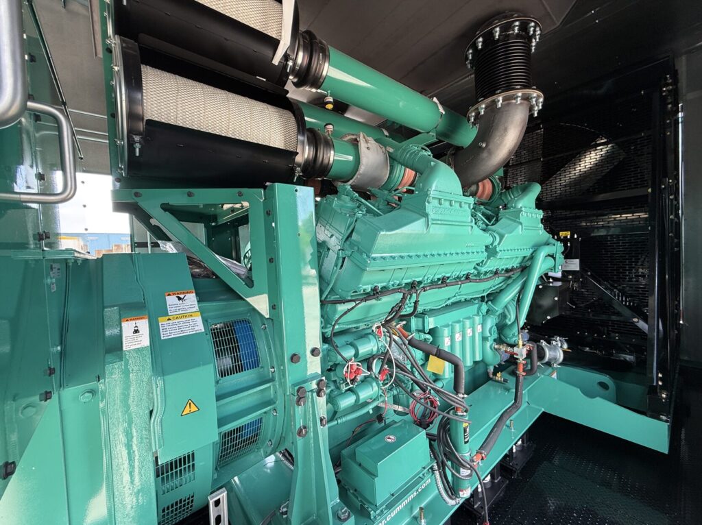 Three-quarter view of New Cummins DQKAN Diesel Standby Generator - Tier 2 with Tier 2 emissions compliance for mission-critical facilities