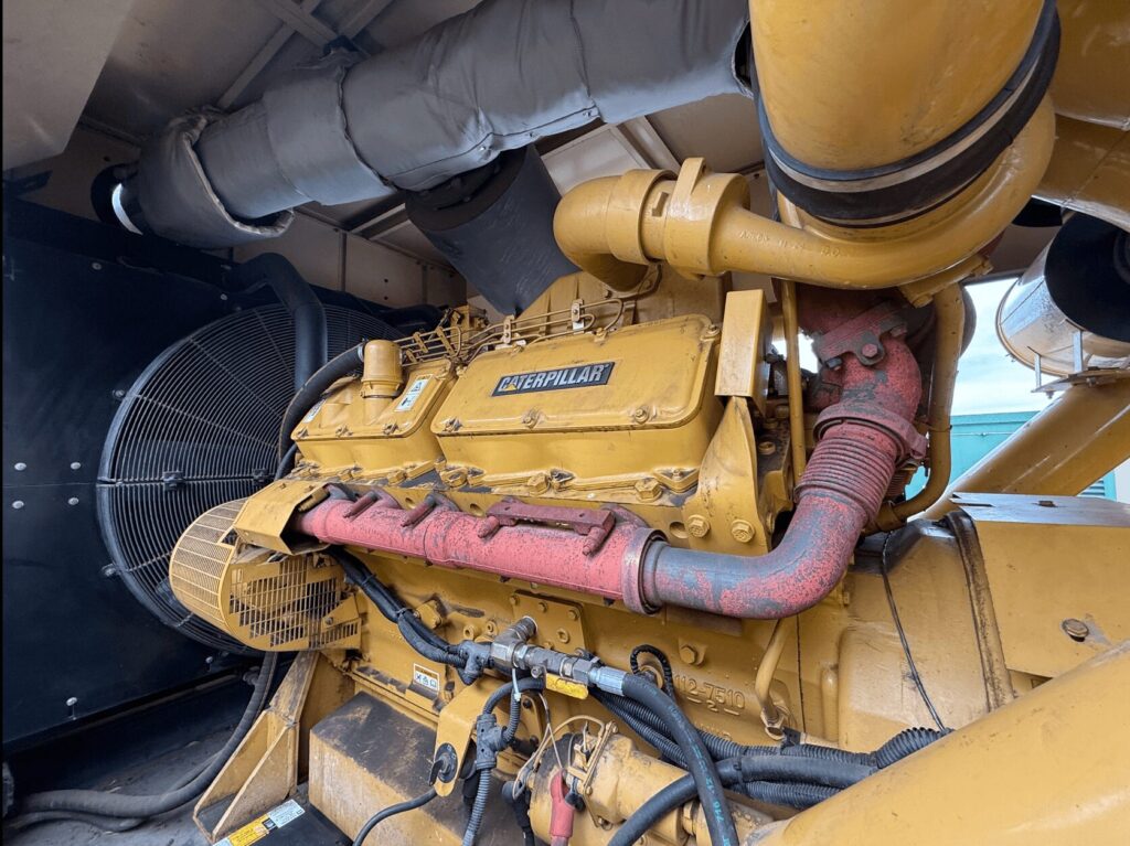 Skid-mounted view of Caterpillar 3412C Standby Diesel Generator diesel unit for temporary power at construction sites