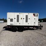 Outdoor shot of Caterpillar XQ350 Trailer Mounted Diesel Generator mounted on trailer for mobile jobsite power