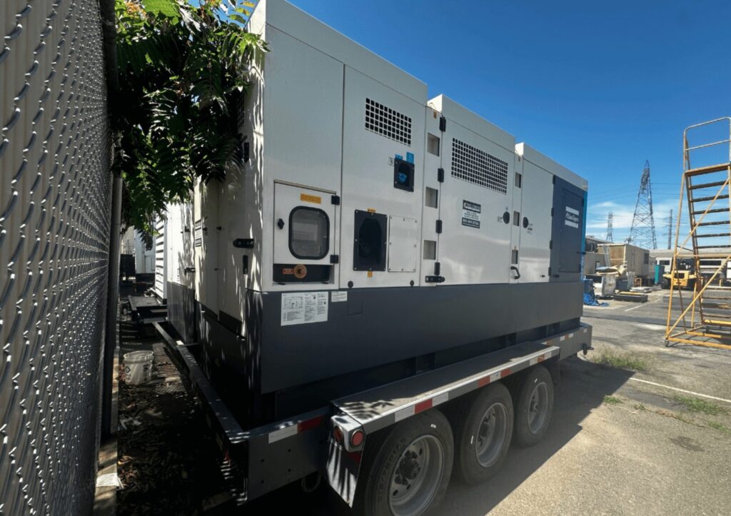 Three-quarter view of Atlas Copco QAS700VD Trailer Mounted Diesel Generator mounted on trailer for mission-critical facilities