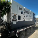 Three-quarter view of Atlas Copco QAS700VD Trailer Mounted Diesel Generator mounted on trailer for mission-critical facilities