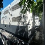 Front angle of Atlas Copco QAS700VD Trailer Mounted Diesel Generator mounted on trailer for emergency standby applications