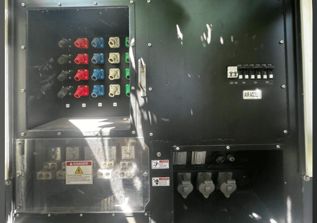 Side view of Atlas Copco QAS700VD Trailer Mounted Diesel Generator mounted on trailer for industrial backup power