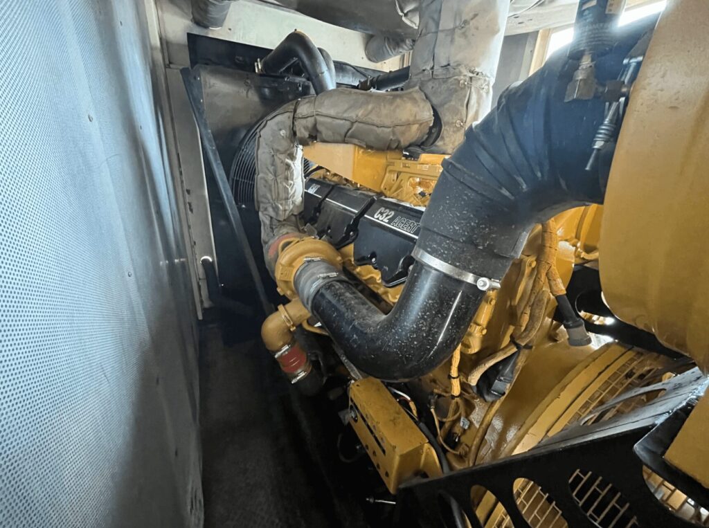 Front angle of Caterpillar MPS1000 Diesel Power Module configured as an industrial power module for emergency standby applications