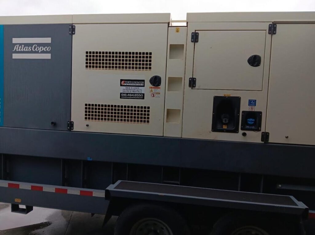 Onsite photo of Atlas Copco QAS250 Trailer Mounted Diesel Generator mounted on trailer for critical standby coverage